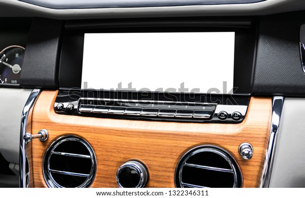 Monitor in car with isolated blank screen use for\
navigation maps and GPS. Isolated on white with clipping path. Car\
detailing. Car display with blank screen. Modern car interior\
details. Mock up