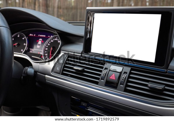 Monitor in car with isolated blank screen use for\
navigation maps and GPS rearview camera and parking assistant.\
Isolated on white with clipping path. Car display with blank screen\
mock up, copy space