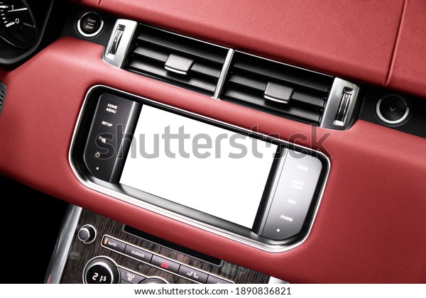 Monitor in car with isolated blank screen use\
for navigation maps and GPS. Isolated on white with clipping path.\
Car detailing. Car display with blank screen. Modern car red\
leather interior\
details.
