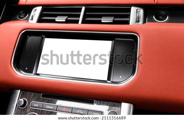 Monitor in car with isolated blank screen use for\
navigation maps and GPS. Isolated on white with clipping path. Car\
detailing. Car display with blank screen. Modern car red leather\
interior 