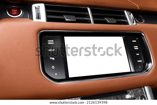 Monitor in car with isolated blank screen use for
navigation maps and GPS. Isolated on white with clipping path. Car
detailing. Car display with blank screen. Modern car brown leather
interior 