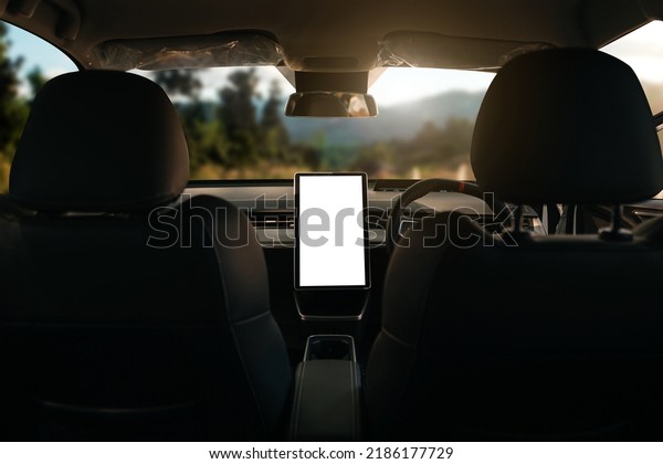 Monitor in EV car with isolated blank screen\
use for GPS. Isolated on white with clipping path. Car display with\
blank screen. car interior\
details.\
