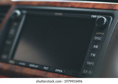 Monitor On The Dashboard Of The Car In FM Receiver