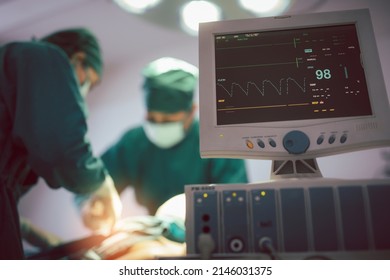 Monitor Screen For A Medical Defibrillator Or Emergency Heart Pump, Showing Vital Signs, Heart Rate, Slow Beating Pulse Of A Dying Coma Patient In A Hospital ICU Room