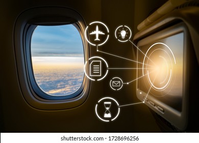 monitor screen on plane for customer entertainment and business pleasure, servicing technology live viewing information on airplane, looking out plane window with beautiful sunset cloud sky 