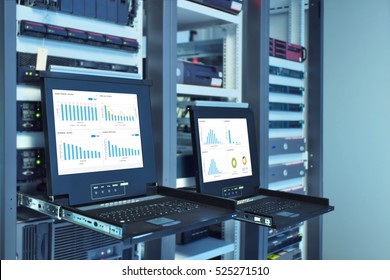 monitor show graph information of network traffic and status of device in server room data center - Powered by Shutterstock