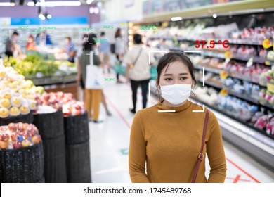 Monitor temperature thermal check scaning people in supermarket prevention coronavirus covid-19 infrared imaging camera screen ai security and medical health before quarantine. - Powered by Shutterstock