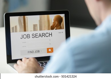 Monitor view over a male shoulder, job search title on the screen, close up. Education, business concept photo - Shutterstock ID 501421324
