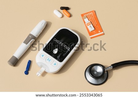 Monitoring Cholesterol: Essential Tools and Pills on Cream Canvas
