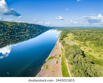 Monitoring environmental violations associated with the violation of the coastal water protection zone by vehicles and unauthorized development, view from a drone