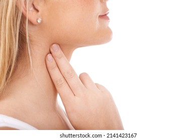 Monitoring her pulse rate carefully. Young woman taking her pulse rate against a white background. - Shutterstock ID 2141423167