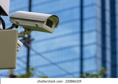 Monitoring Security Camera The Backdrop Of The Blue Blur Building.