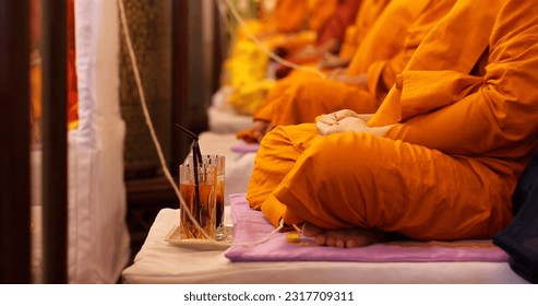 Monk meditating pray together in salute. Buddhist monk vipassana meditate to calm the mind. Religious concept - Powered by Shutterstock