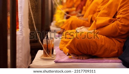 Monk meditating pray together in salute. Buddhist monk vipassana meditate to calm the mind. Religious concept