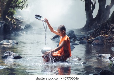 monk play water at stream river - Powered by Shutterstock