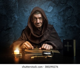 Monk - priest - front of the church holding the Bible