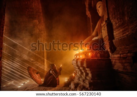 Monk with sun light from outside to inside, Bagan Myanmar 