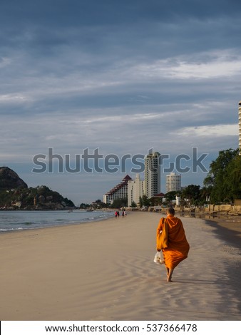 Monk is walking back to the temple after do the routine to publicised Buddhism task.