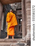  A monk who cannot be identified is seen walking through the main doorway at the UNESCO World Heritage temple site Wat Phu in Southern Laos.