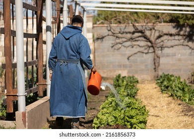 Monk Working In The Convent Garden