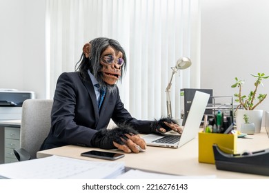 Monkey Business Man Typing On Computer