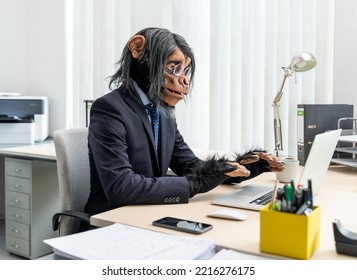 Monkey Business Man Typing On Computer