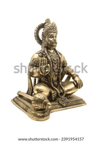 monkey god lord hanuman statue of hindu mythology sitting and blessing made of golden brass isolated in a white background