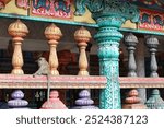 Monkey sitting on Hindu temple near the Batu Caves, Malaysia