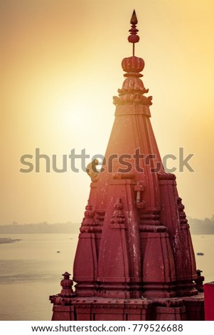 Monkey sitting on temple bell Varanasi Uttar Pradesh India Asia