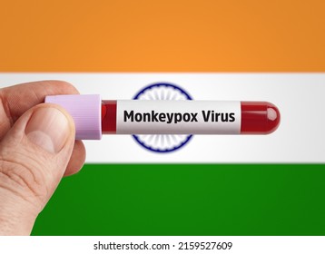 Monkeypox virus (MPXV) concept: Scientist holding Monkeypox virus infected blood in test tube in front of India flag.