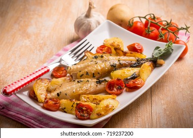 monkfish with potatoes and tomatoes, selective focus