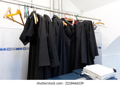 The Monks' Black Robes Hang On Hangers.