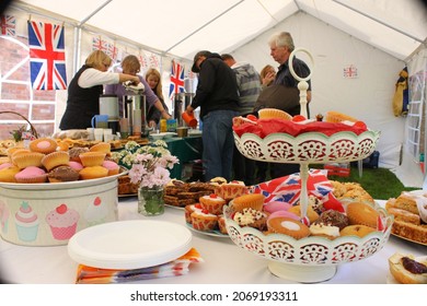 Monks Kirby UK - circa 2012 Customers buy tea and cakes at an English country fair.