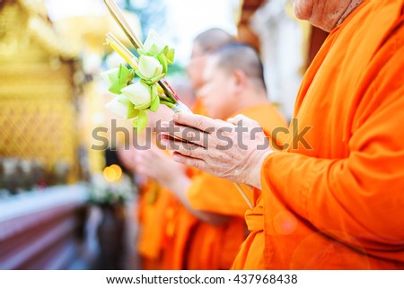 Monks pray, Put the palms of the hands together in salute with flower, thailand