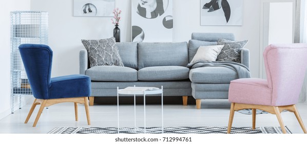 Monochromatic Living Room With Vintage Blue And Pink Armchairs In Elegant Interior