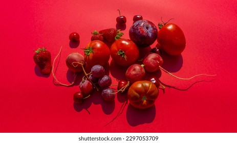 monochromatic red vegetable and fruit distributed still life