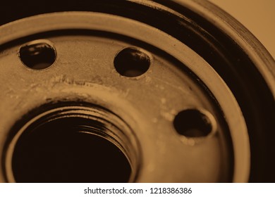 Monochrome background image of oil filter close up. Artwork from auto part in macro photography in sepia tones.