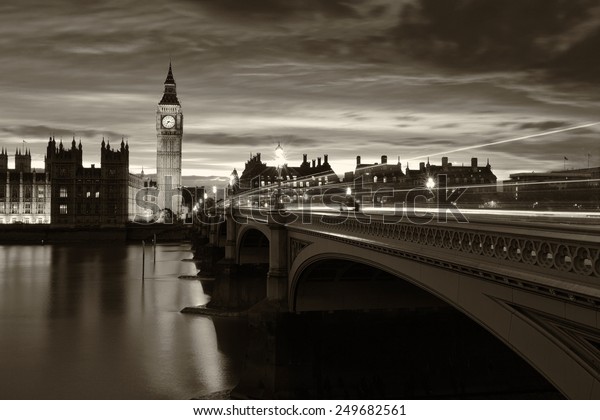 Monochrome Big Ben and\
London at night with the lights of the cars passing by after rain,\
London and England