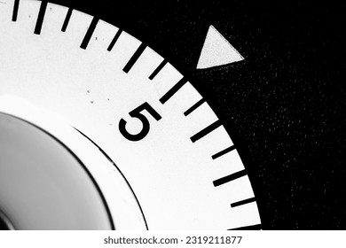 monochrome close-up of an analog laboratory timer set to five - Powered by Shutterstock