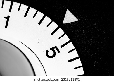 monochrome close-up of an analog laboratory timer set to four - Powered by Shutterstock