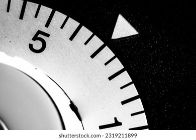 monochrome close-up of an analog laboratory timer set to seven - Powered by Shutterstock