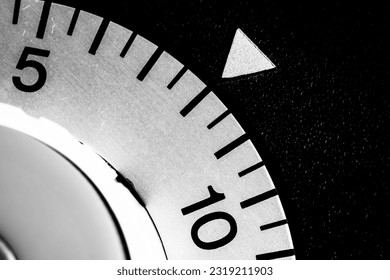 monochrome close-up of an analog laboratory timer set to eight - Powered by Shutterstock