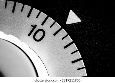 monochrome close-up of an analog laboratory timer set to eleven - Powered by Shutterstock