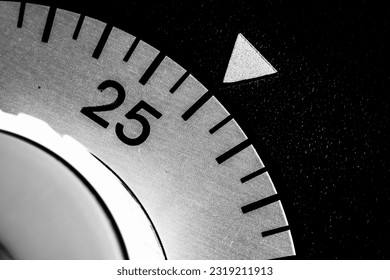 monochrome close-up of an analog laboratory timer set to 26 - Powered by Shutterstock