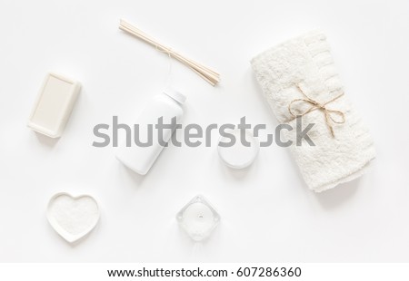 monochrome cosmetic set in SPA concept on whitebackground top view