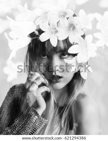 Similar – Young blonde woman posing with a huge daisy