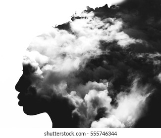 Monochrome Double Exposure Of Girl Profile Portrait And Stormy Cloudscape