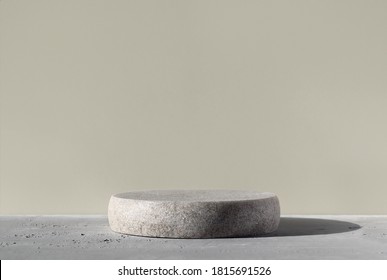 Monochrome gray template for mockup, banner. Flat round granite pedestal on textured background. Stone stand for natural design concept. Horizontal image, center composition, hard light, front view
