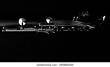 monochrome image of a clarinet in the dim light - Shutterstock ID 1904805469
