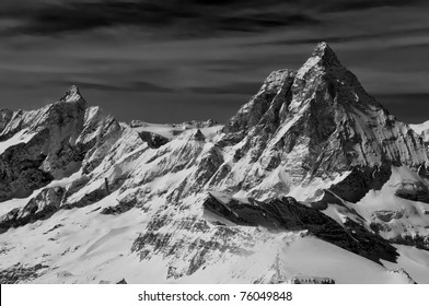 Monochrome of the Matterhorn in the swiss alps with the dent d'herens on the left